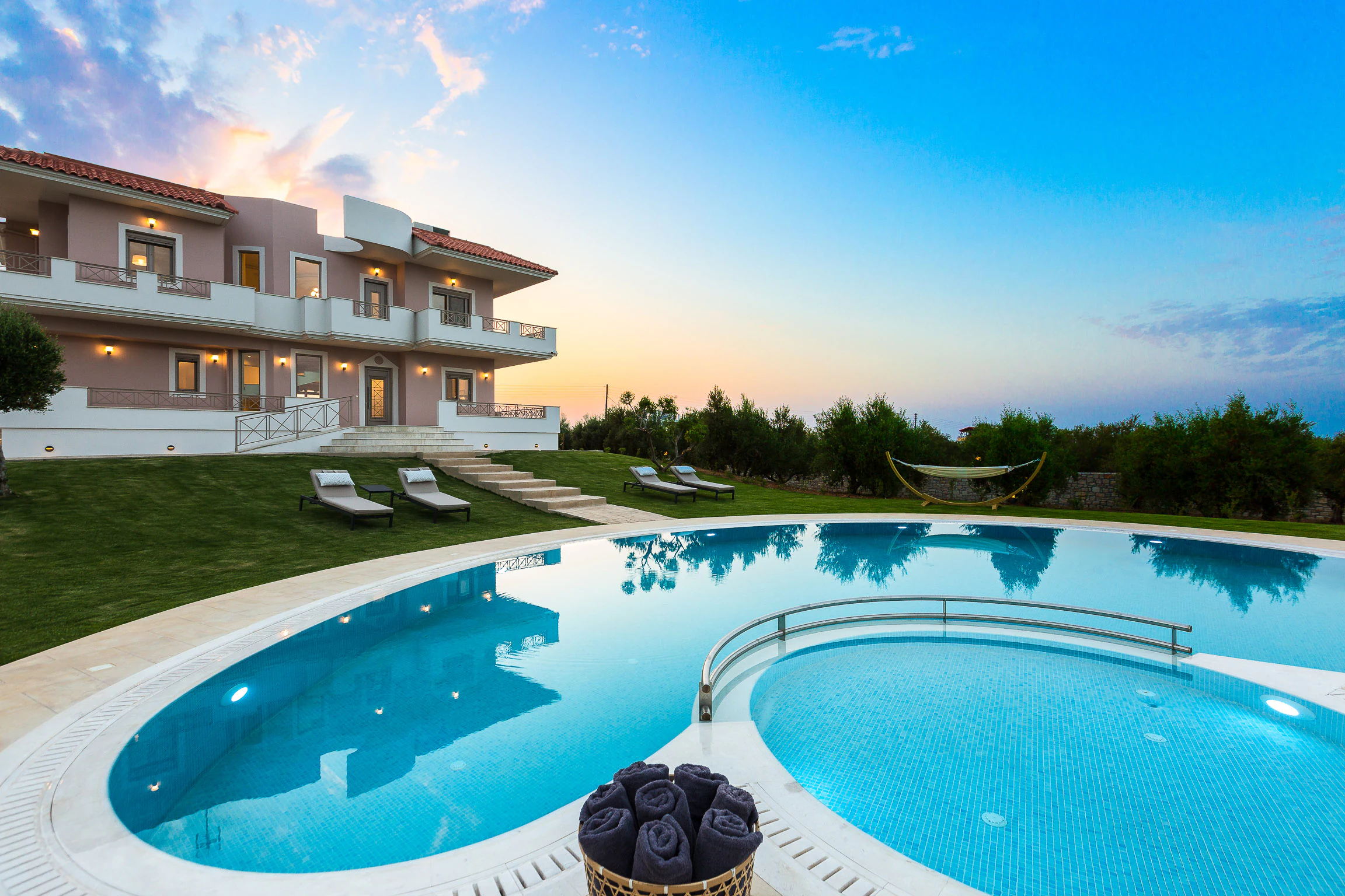 Aelia Residence and its curved private pool at blue hour